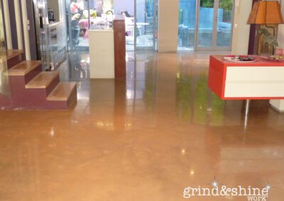 Concrete Grinding on Ground Floor of Coloured Concrete Slab